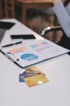 Young Asian business woman using smartphone and credit card for online shopping. Online Payment.