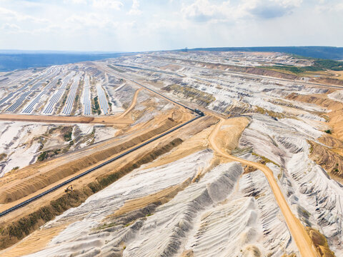 Aerial view of Hambach open pit mine with large-scale solar photovoltaic modules on reclaimed land, showcasing the transition to renewable energy in Elsdorf, North Rhine-Westphalia, Germany.