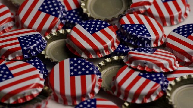 Pile of American flag bottle caps rotating