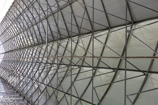 Geometric metal framework supports translucent panel roof structure