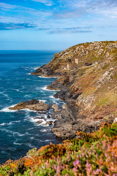 The historic Botallack Mine ruins stand on a steep Cornwall cliff