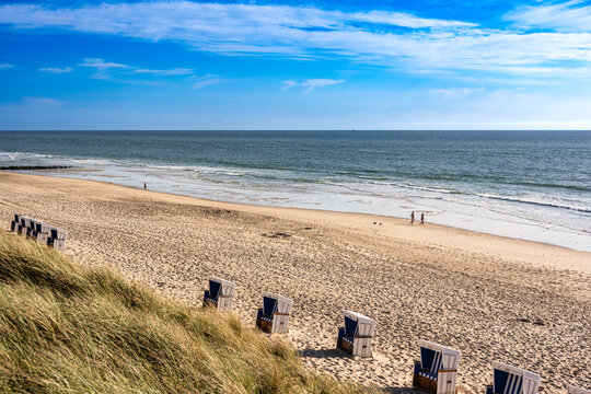 A beach chair rests on the sandy coast of Rantum in Sylt