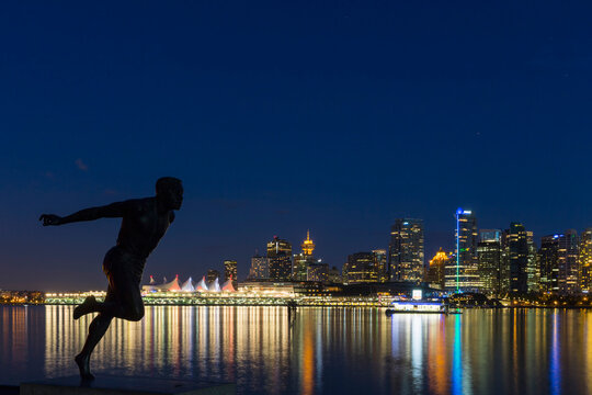 Canada, Vancouver, Harry Jerome statue and skyline at night