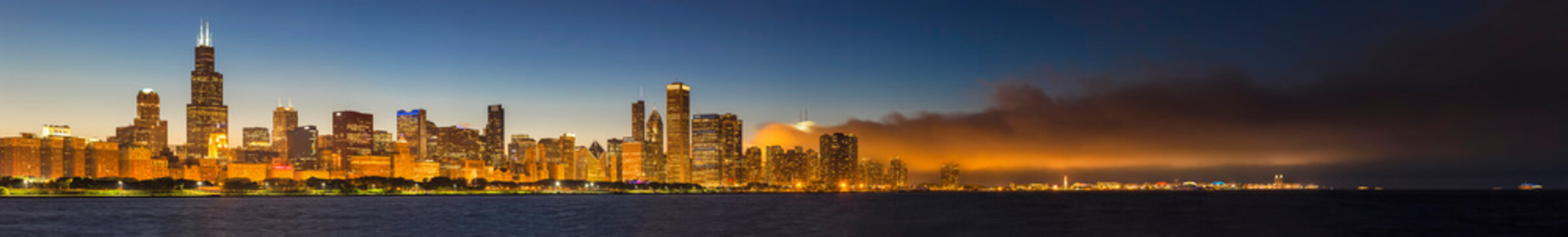 USA, Illinois, Chicago, skyline with Lake Michigan at dusk