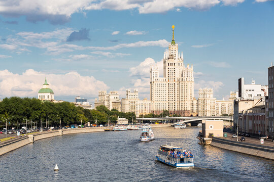 Russia, Central Russia, Moscow, Moskva river and excursion boats, Seven Sisters in the background