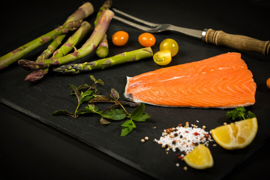 Row salmon and green asparagus