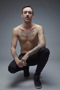 Portrait of young man with tatoos