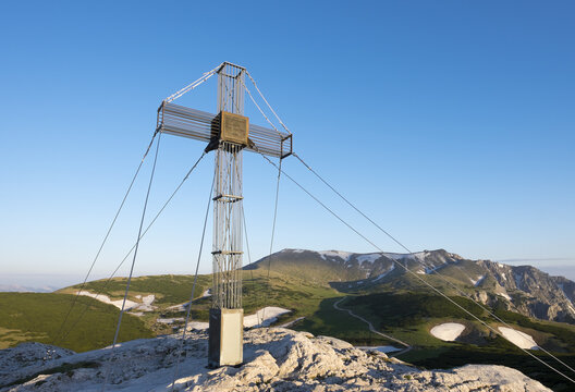 Austria, Lower Austria, Vienna Alps, Summit cross on Waxriegel, Schneeberg in the background