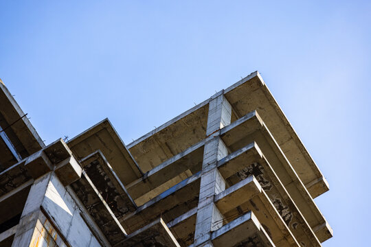 Unfinished Concrete Building Structure Against Blue Sky