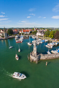 View of the picturesque port of Lindau in Bavaria, Germany, with boats bobbing in the water