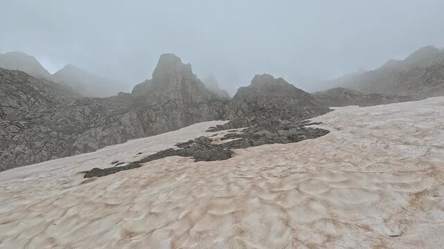 Snowfield and Rocky Peaks in Mist on Zonaria Trail, Mount Olympus Greece