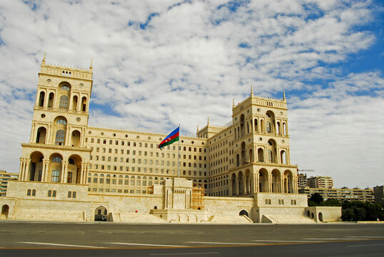 Azerbaijan, Baku, Imposing white presidential palace with the azeri flag floating in front of it, overlooking Baku Boulevard, a wide tar avenue