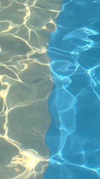 Water flowing in a pool with sunlight creating patterns and reflections