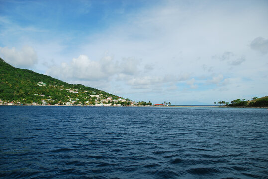 Dominica, Roseau, view of colorful villages south of Roseau on the green hills