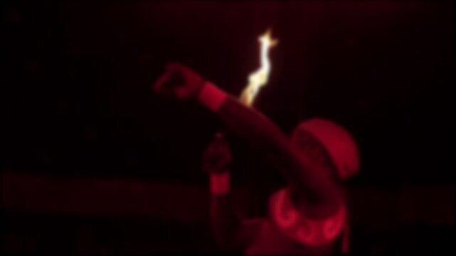 Dynamic fire performance with blurred artist manipulating flames against dark background, showcasing dramatic visual spectacle of circus act at night, slow motion, blurry