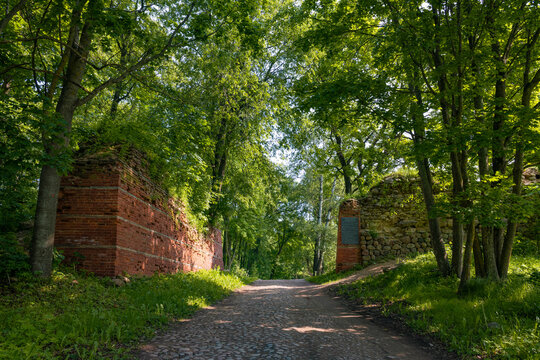 At the entrance to the territory of the ancient Gdov fortress on a sunny June day. Gdov, Pskov region