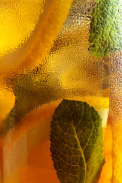  Iced tea in a misted glass. Macro shot.