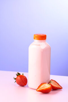 Strawberry yoghurt in eco disposable jar and fresh berries.