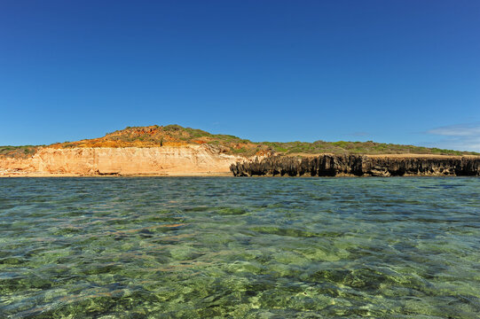 Madagascar, Ramena, Mer d'Emeraude, view of the coast from the emerald and transparent sea