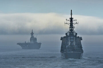 Japanese destroyers underway at sea on cloudy day © zapper