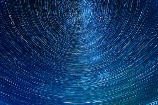Star trails captured during the Perseid meteor shower, showcasing circular motion around the North Star in a clear night sky