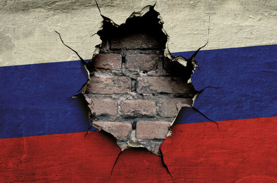 flag of Russia is painted on an old wall with cracks