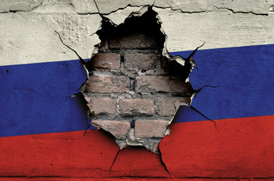 flag of Russia is painted on an old wall with cracks