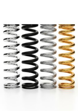 Four Industrial Metal Coil Springs in Chrome Black Steel and Gold Finishes Isolated on White Background