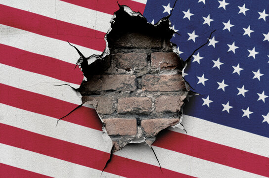 national flag of the United States of America is painted on an old wall with a large hole