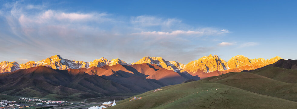 Golden Sunrise over Maya Snow Mountain with Alpine Grassland