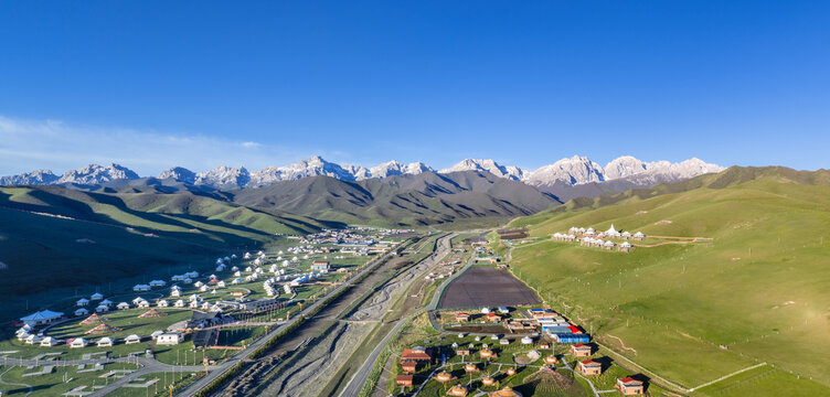 Morning Light on Tibetan Tent Camps and Maya Snow Mountain Grassland Valley, Gansu, China.