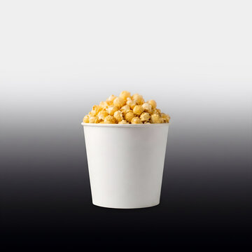 Fresh caramel popcorn in white bucket