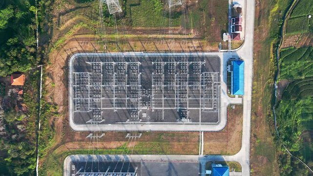 Aerial view of the Ampel 150kV Substation with Merbabu and Merapi mountains in the background in Kecamatan Ampel, Jawa Tengah, Indonesia.