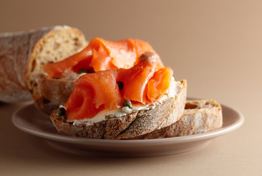 Sandwich with smoked trout, cream cheese, and capers.