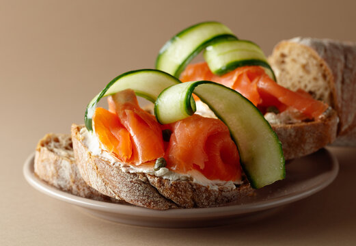 Sandwiches with smoked trout, cream cheese, fresh cucumber and capers.