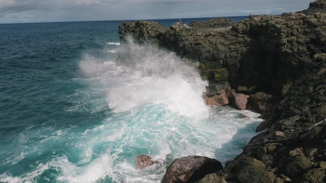 Big waves crashing on rocky coasts of Mauritius in slow motion - near Pont Naturel