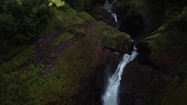 An ascending drone/aerial shot of cascade 500 pieds/500 foot waterfall in Mauritius