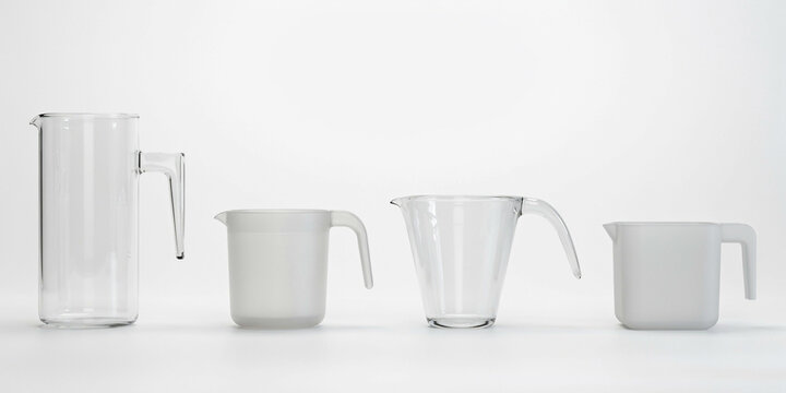 Set of four clear glass and plastic measuring pitchers on white background