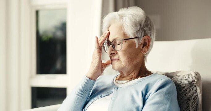 Headache, thinking and elderly woman in home for memory loss, head pain and stress with dementia. Retirement, house and senior person with migraine, strain and worry for Alzheimers or mental health