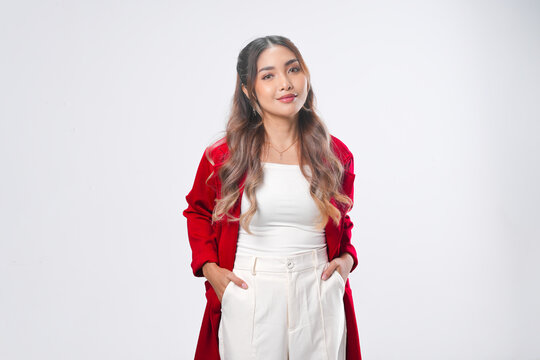 Beautiful young Asian woman wearing red jacket is posing with confidence.