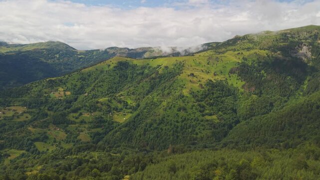 Panoramic aerial view of lush green mountain ridges and pine forests near Kotlovi on the Montenegro-Kosovo border