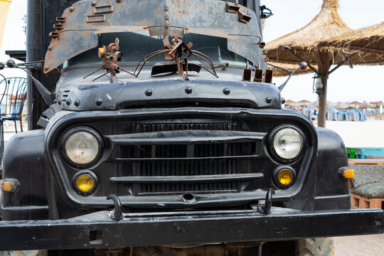 Vintage Black Truck Decorated with Recycled Metal Sculptures