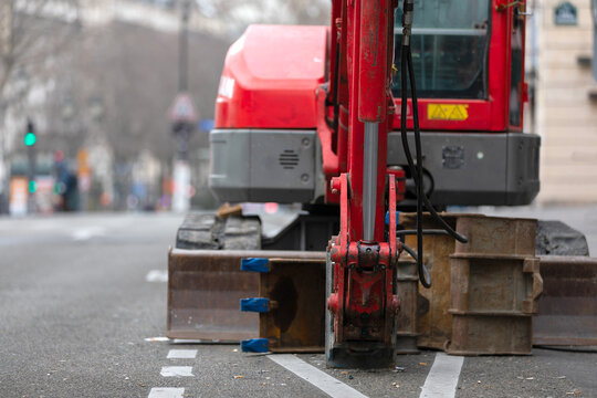 Mini Excavator with Hydraulic Breaker on Urban Street