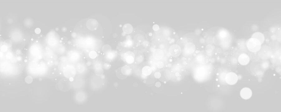 Soft monochrome bokeh lights scattered densely across a dark background in varying sizes and opacities on transparent background