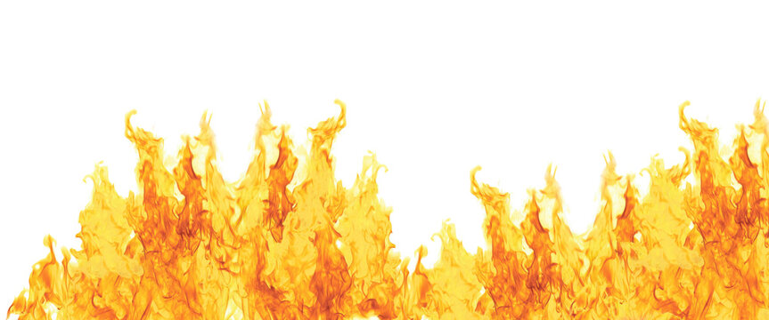 Bottom border of intense yellow fire flames isolated on black background