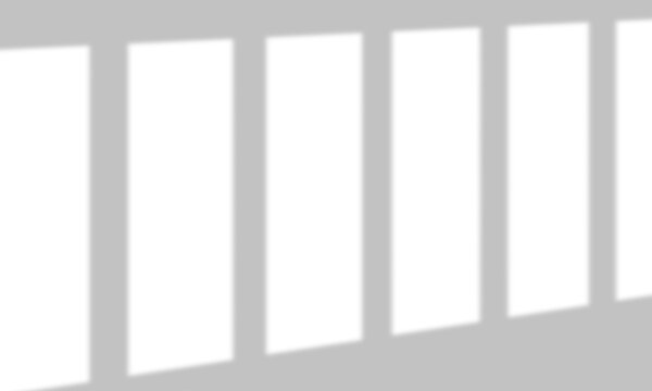 Abstract shadow overlay from vertical window blinds creating minimalist striped patterns.
