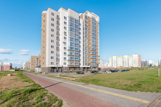 Modern Residential Apartment Building Exterior with Paved Walkway