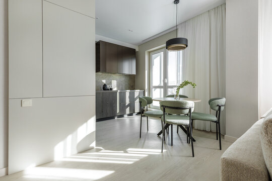 Modern Apartment Interior with Kitchen, Dining Area, and Living Zone