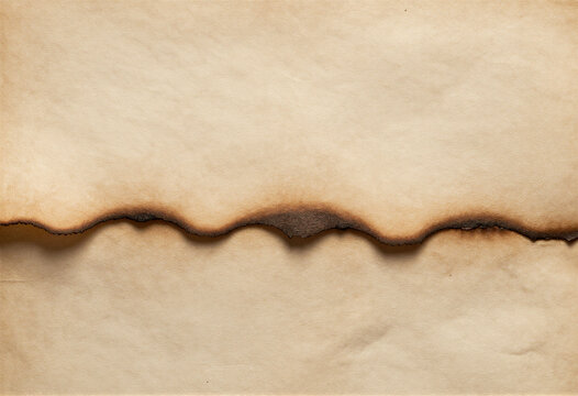 Burnt edge of aged parchment paper