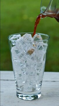 Pouring Iced Americano Coffee into Glass